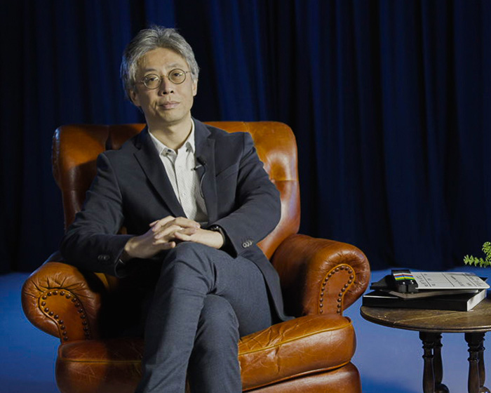 Nicolas Kang-Riou sat in an armchair smiling